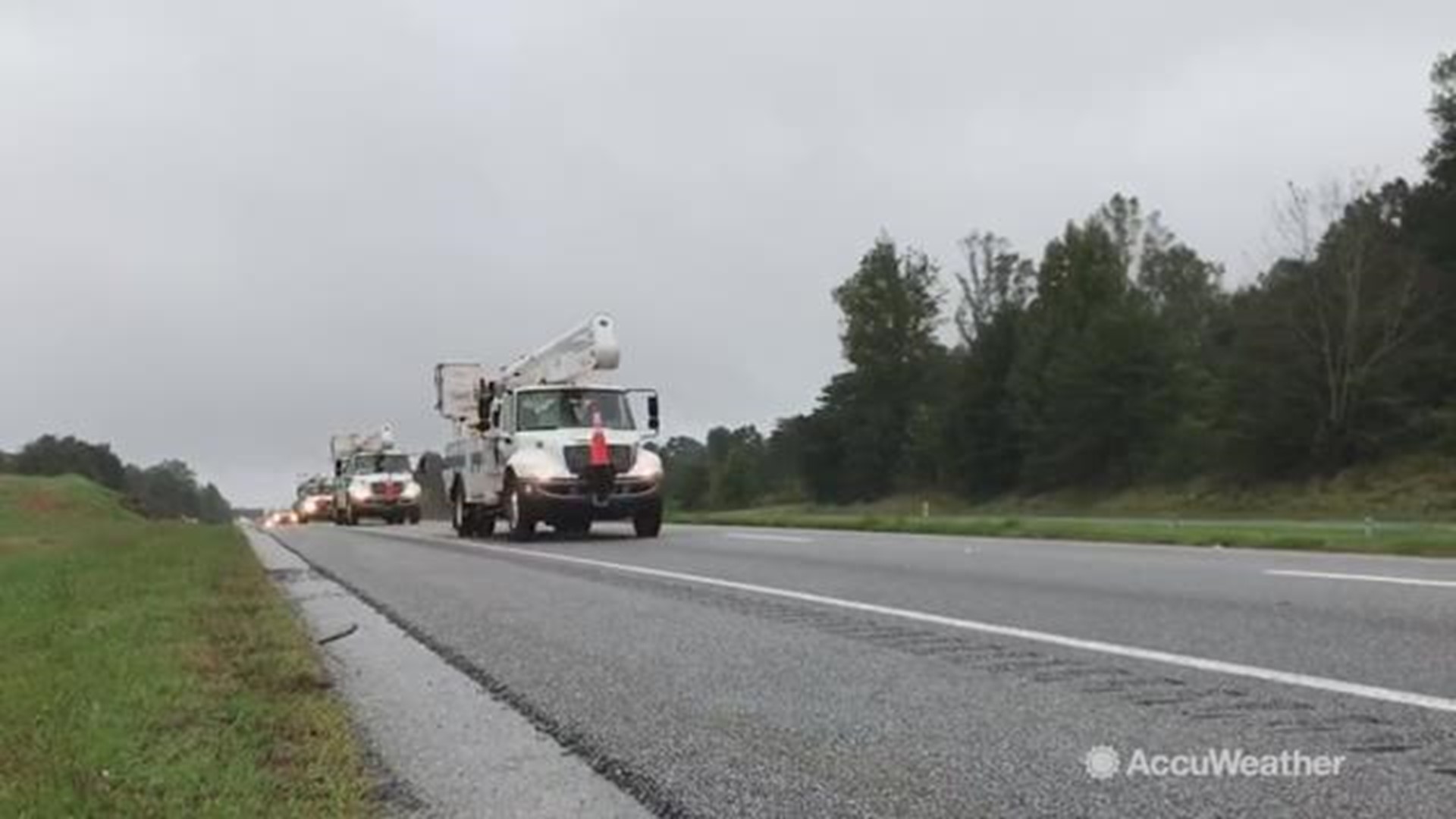 Power crews are seen here crossing state lines form North Carolina to South Carolina as they plan for power outages as Hurricane Michael barrels toward the Florida Panhandle.