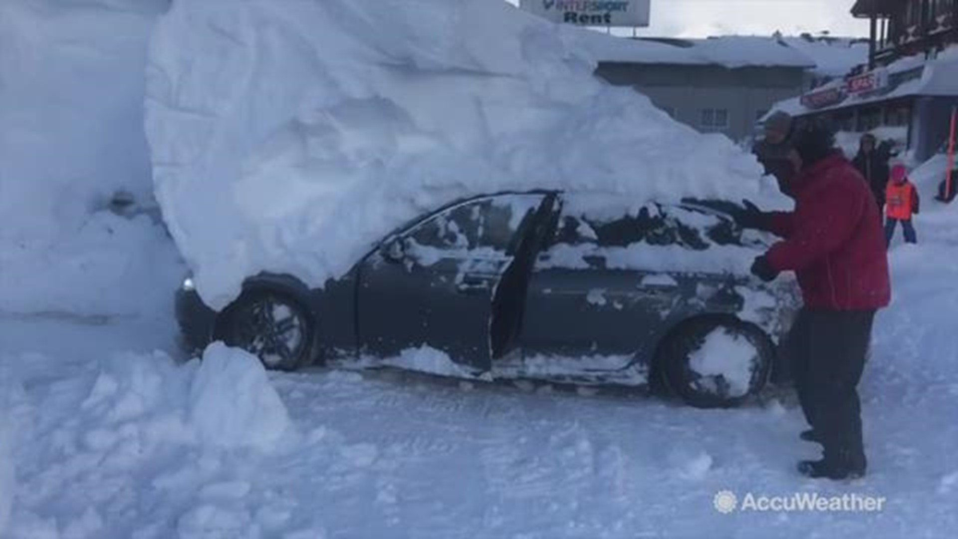 This is the moment an Austrian hotel worker reversed his vehicle in the car park with a six-foot-high pile of snow stuck on top of it. This was filmed on January 11, in Obertauren, Austria.
