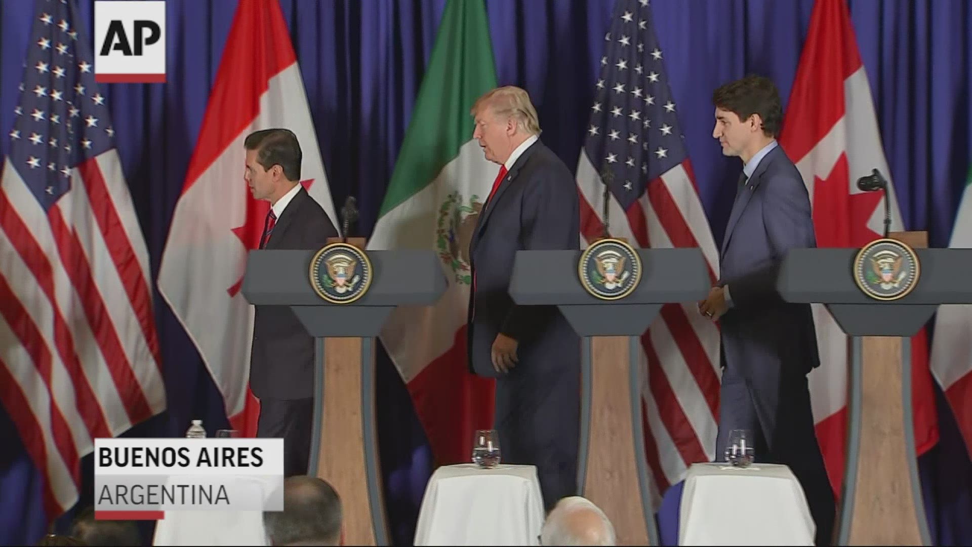 Mexico's President Enrique Pena Nieto, US President Donald Trump, and Canadian Prime Minister Justin Trudeau, sign a new free trade agreement in Buenos Aires, on November 30, 2018.