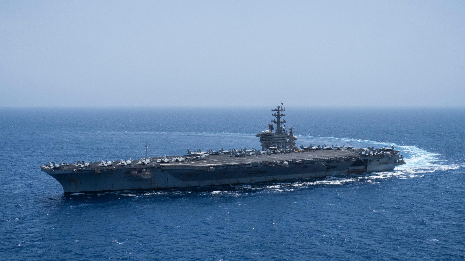2 US Navy aviators eject while landing plane on aircraft carrier off ...