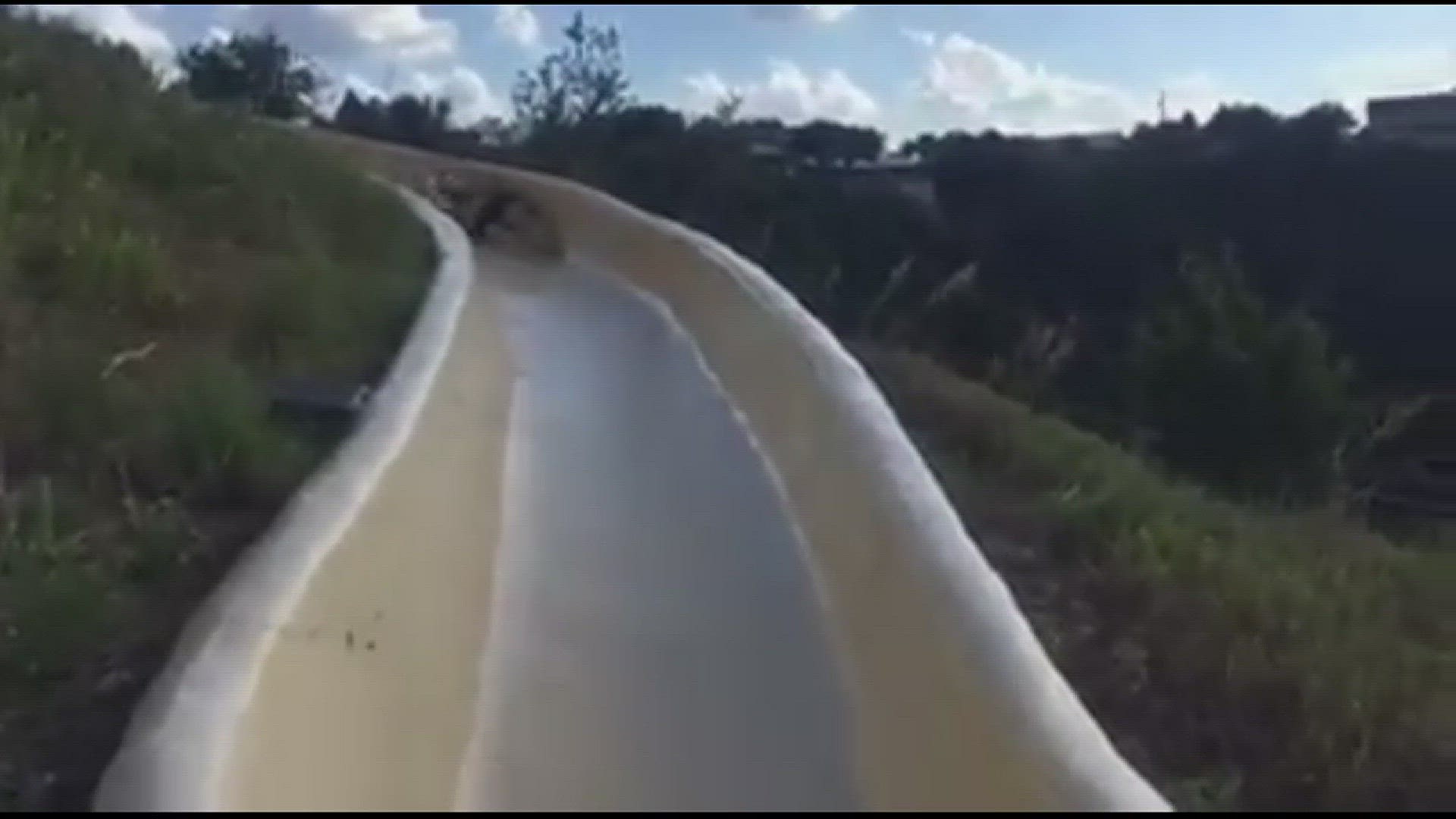 Video captures moment man flies off water slide onto rocky cliff