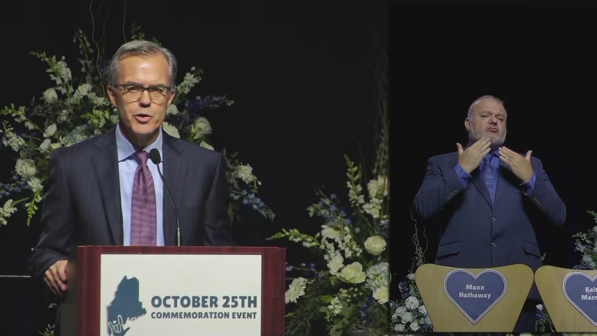 NESN sports announcer Tom Caron shares welcome remarks at the Lewiston Commemoration event. He introduces a slideshow of the those killed and their families.