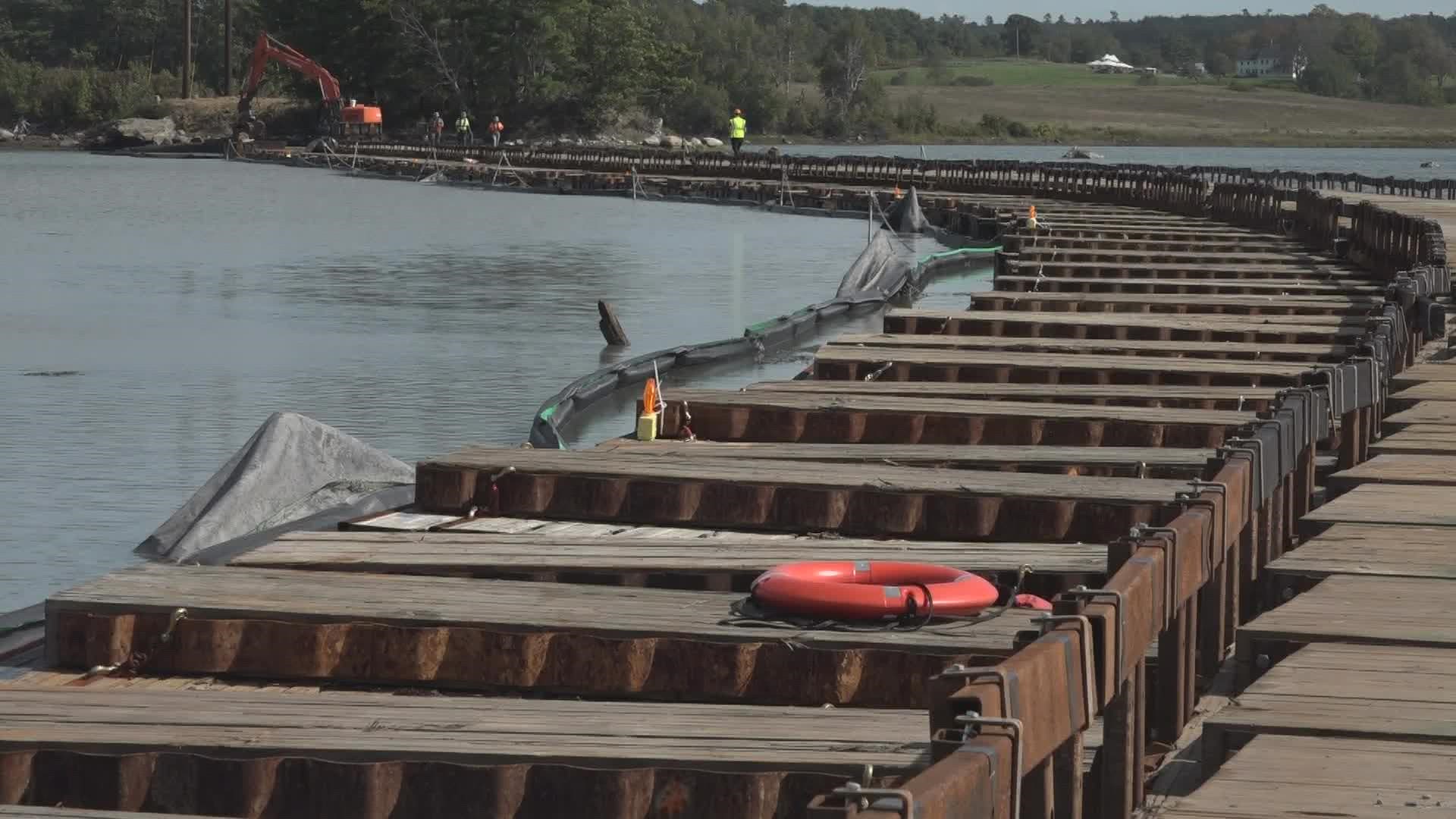 The 'floating road' in Great Salt Bay off of Newcastle has allowed Central Maine Power to tend to an aging transmission line without disrupting the environment.