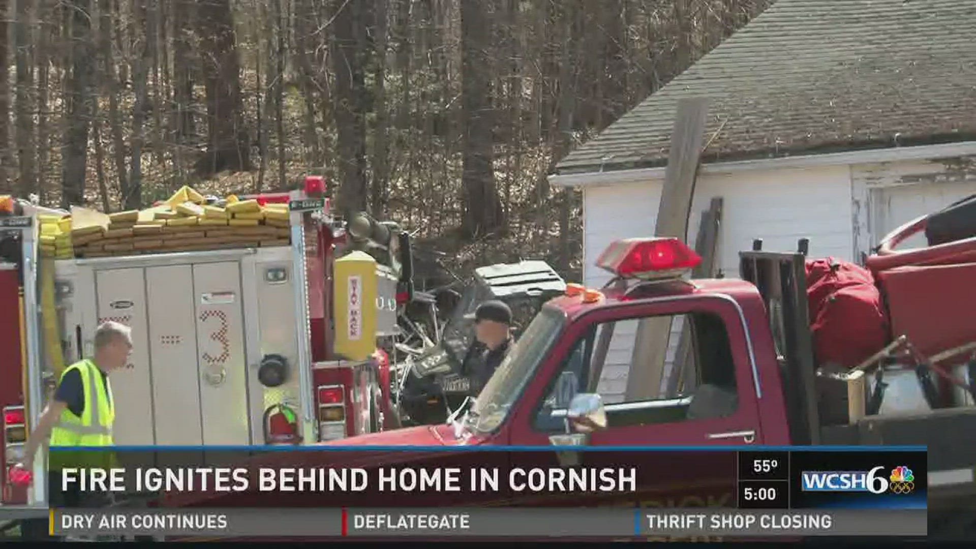 A fire ignited behind a home in Cornish Monday.