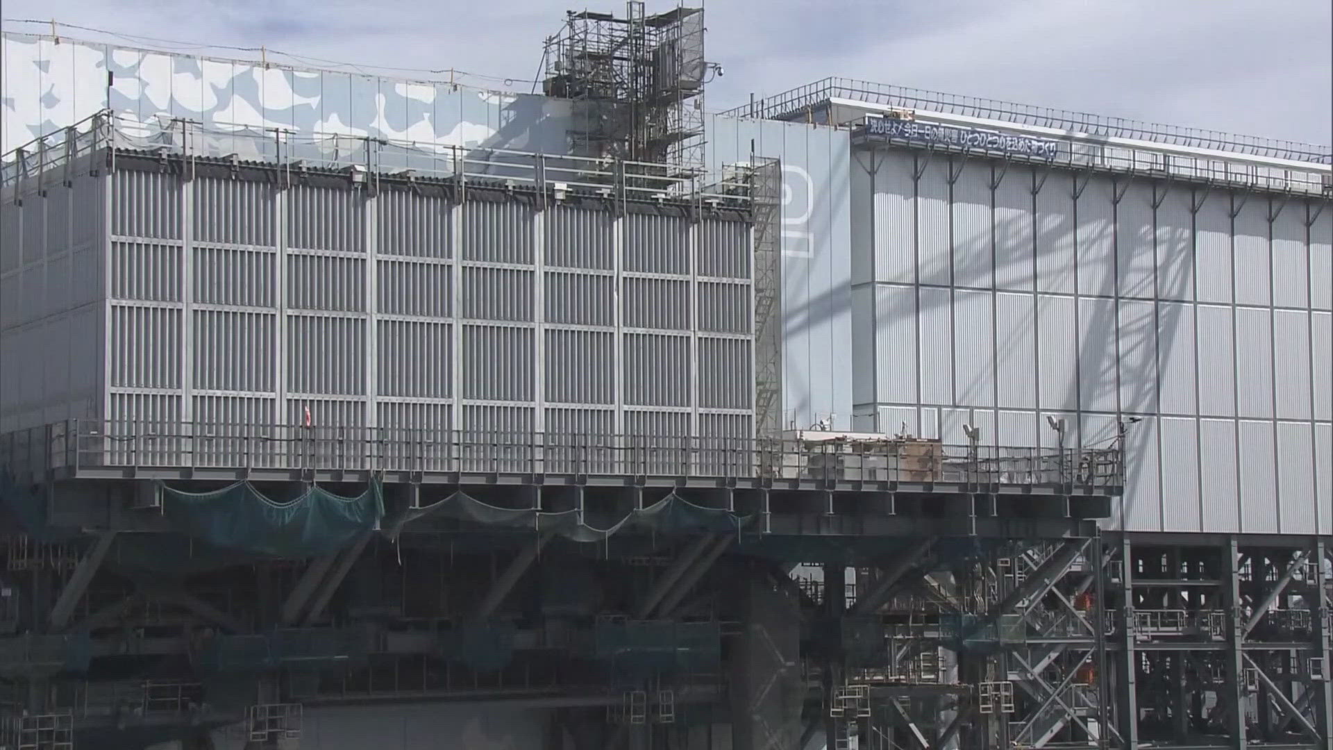 Japanese officials say the test removal of nuclear fuel debris from the damaged Fukushima Daiichi nuclear power plant has been completed. 