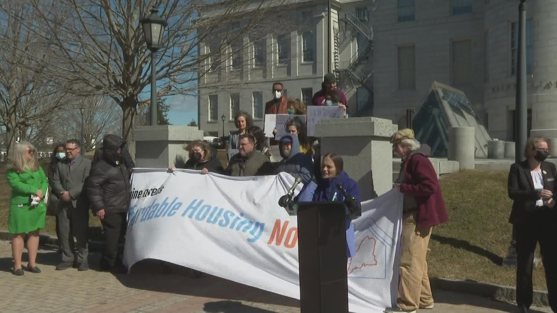 Advocates for affordable housing met with legislators outside the State House.