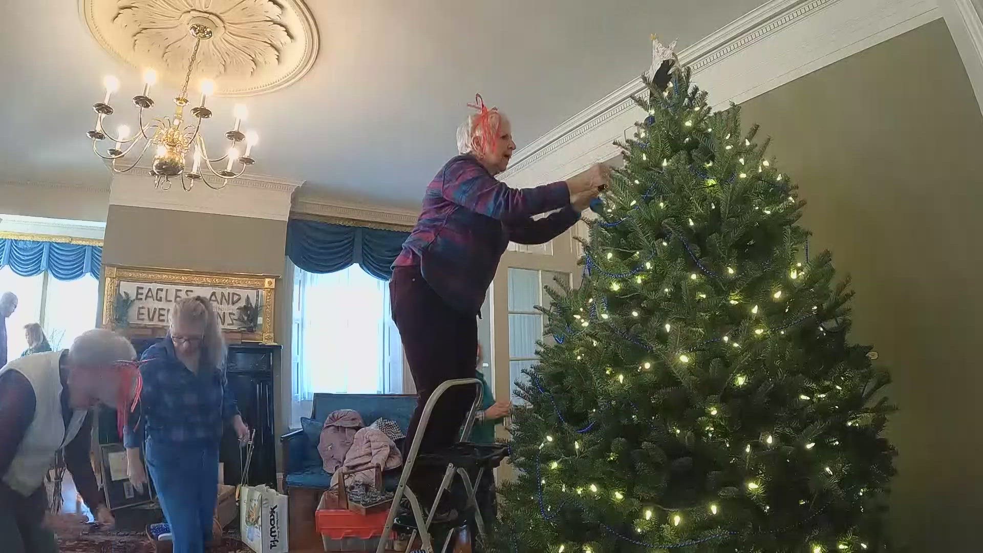 Members of the Kennebec Garden Club spend months preparing, then one chaotic morning decorating the Blaine House.