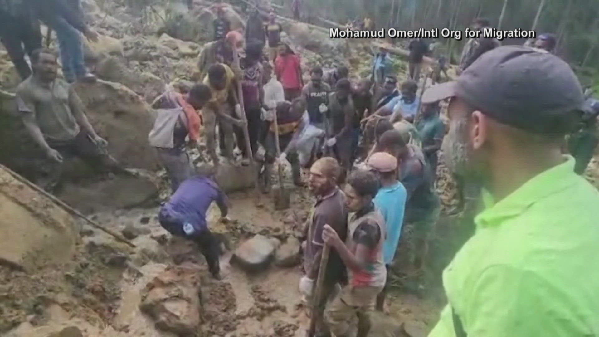 Local government officials say they believe more than 2,000 people were buried alive.