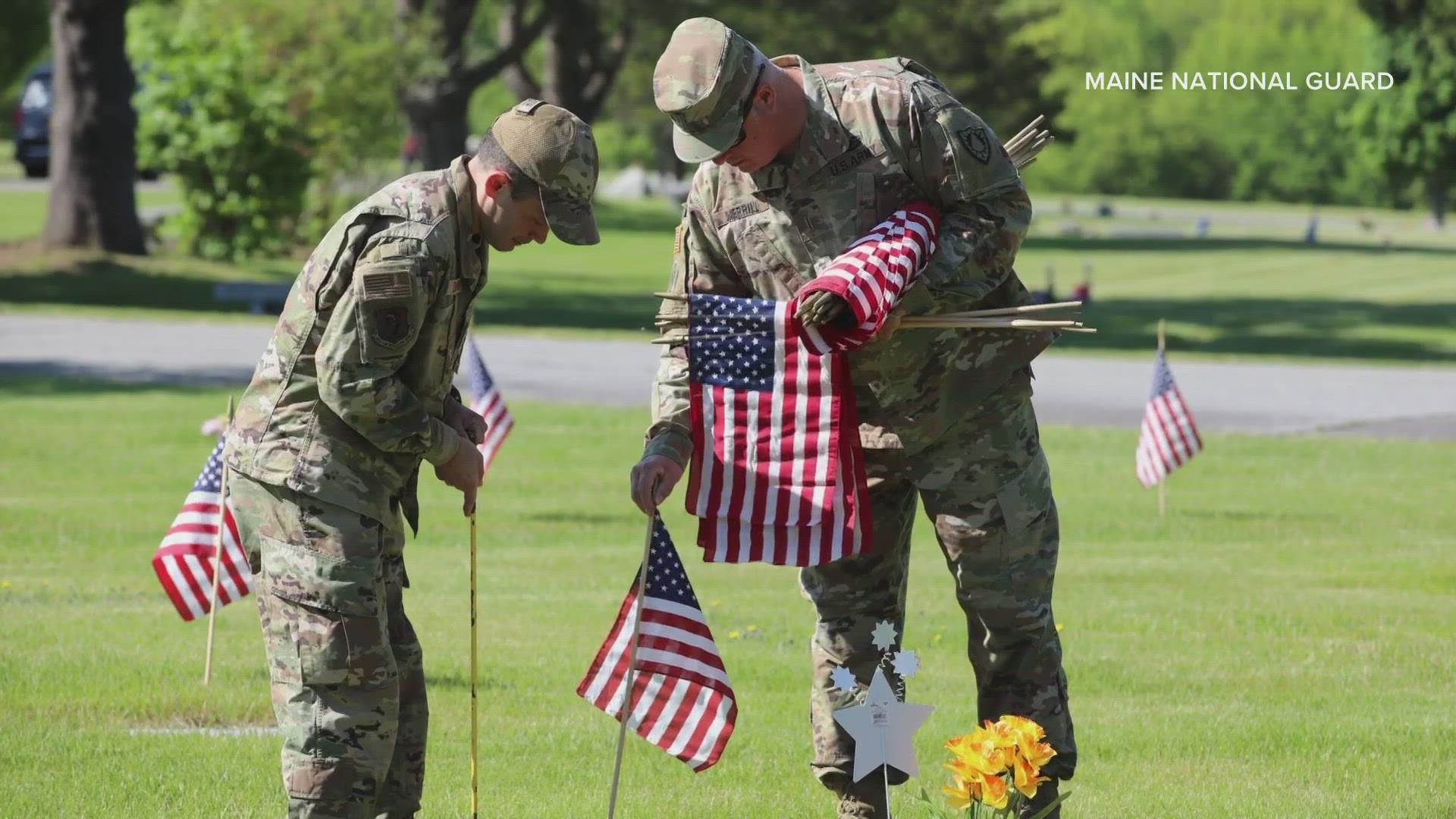 Guardsmen and their families placed flags over the weekend in preparation for Memorial Day.