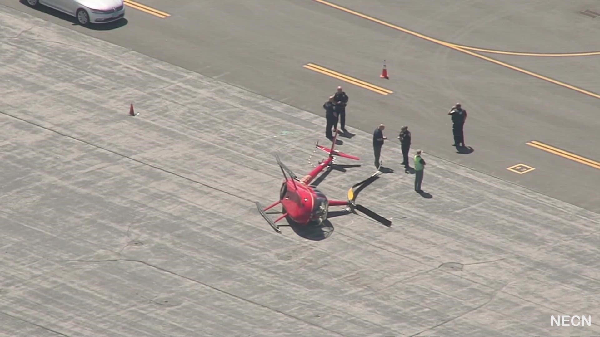 Images from the scene showed a red helicopter on its side.