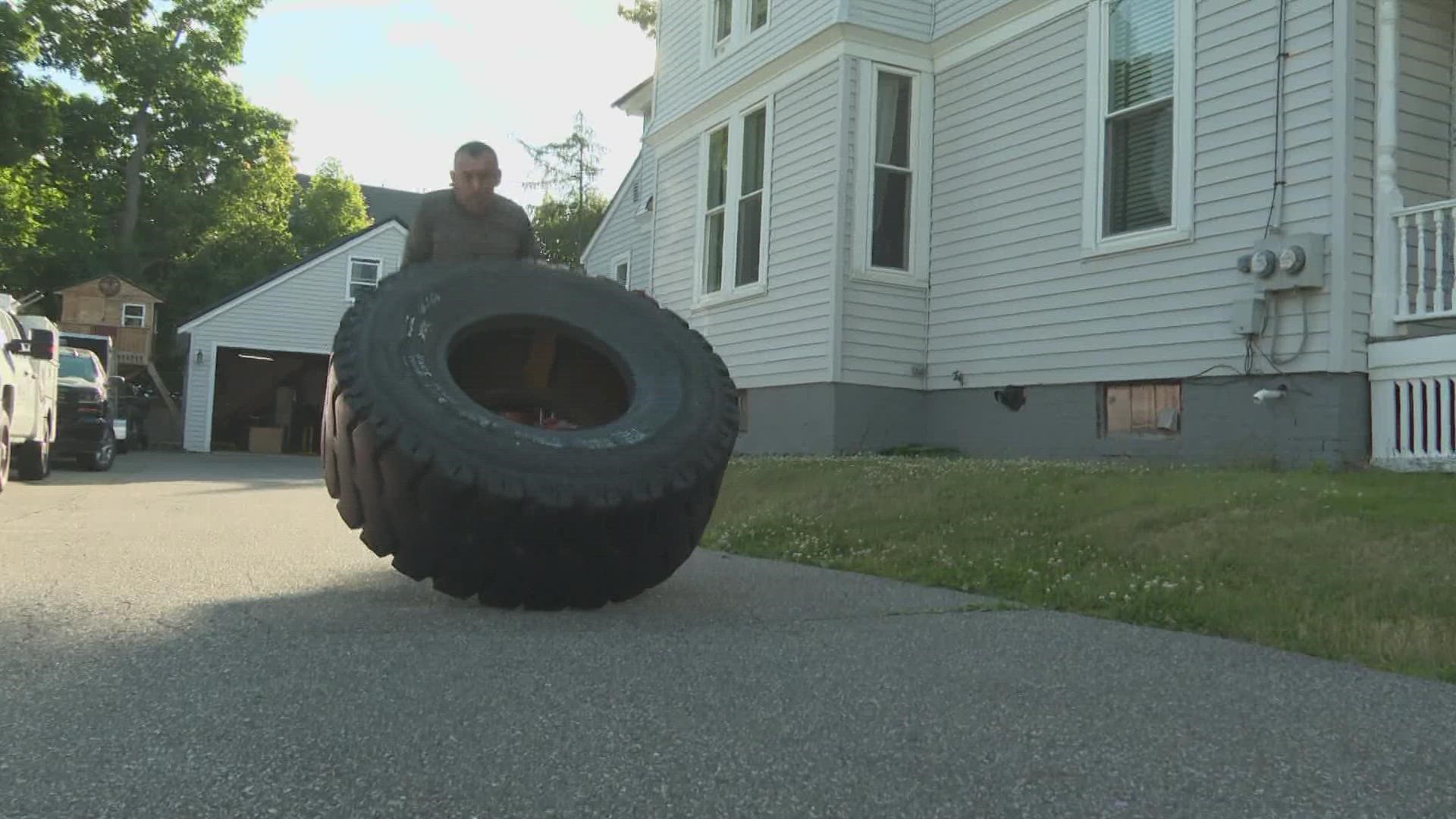 A Bangor man is attempting to break a personal time record and funds raised record by flipping a giant tire for one mile.