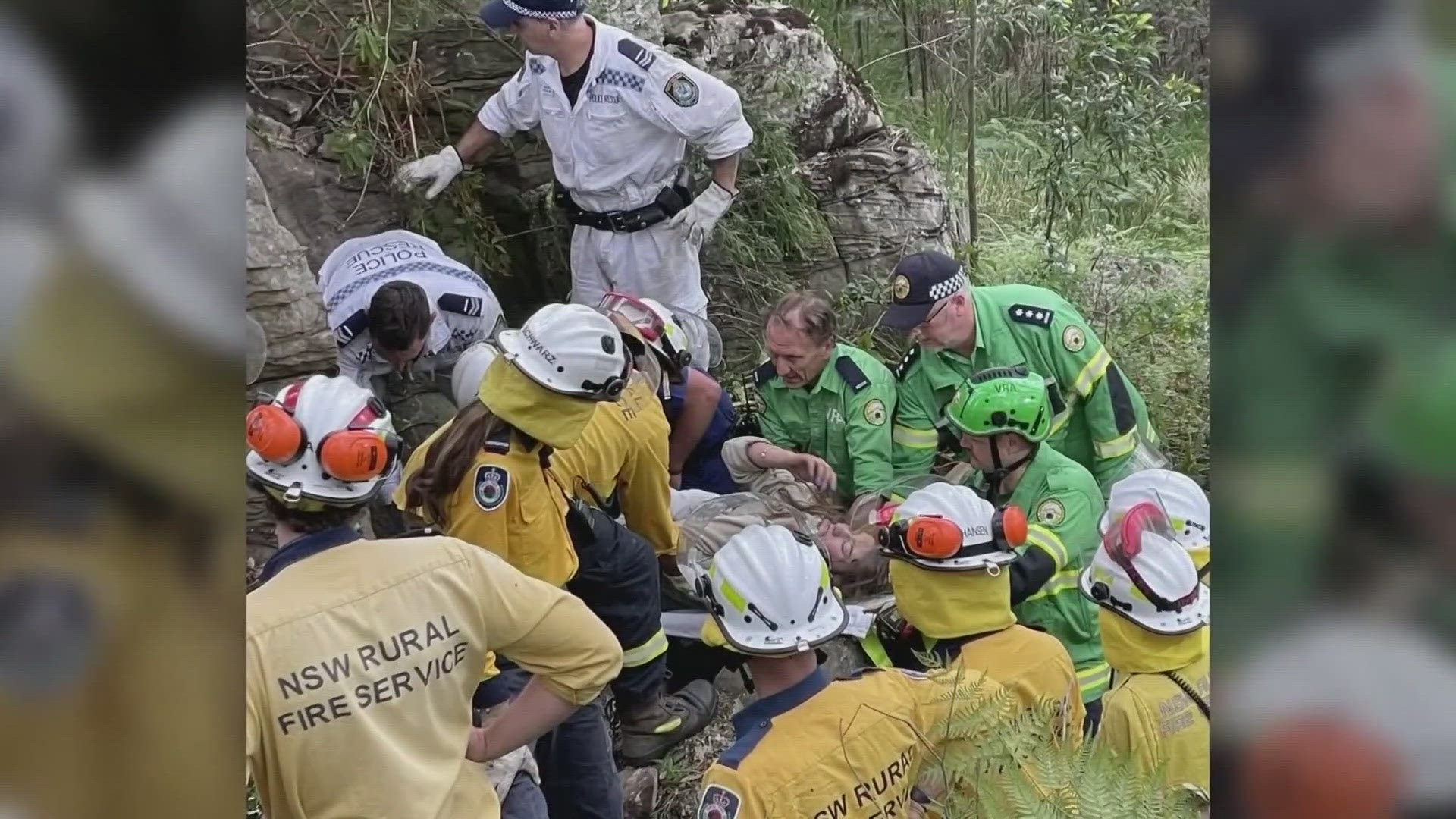 Rescuers in Australia spent hours working to free the woman who wound up stuck, wedged upside down between boulders after she tried to retrieve a phone she dropped.