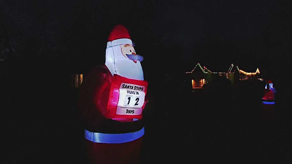 Neighborhood loves blowup Santas