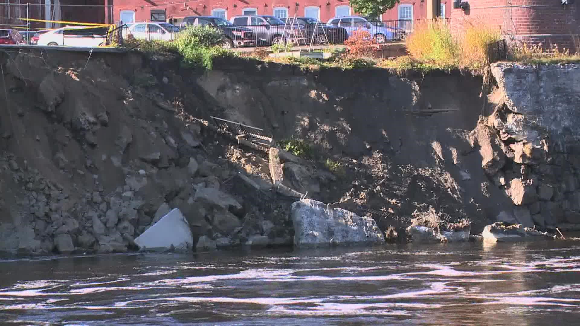 According to city officials, Saturday's powerful storm washed away roughly 77 feet of the wall and walkway along the river.