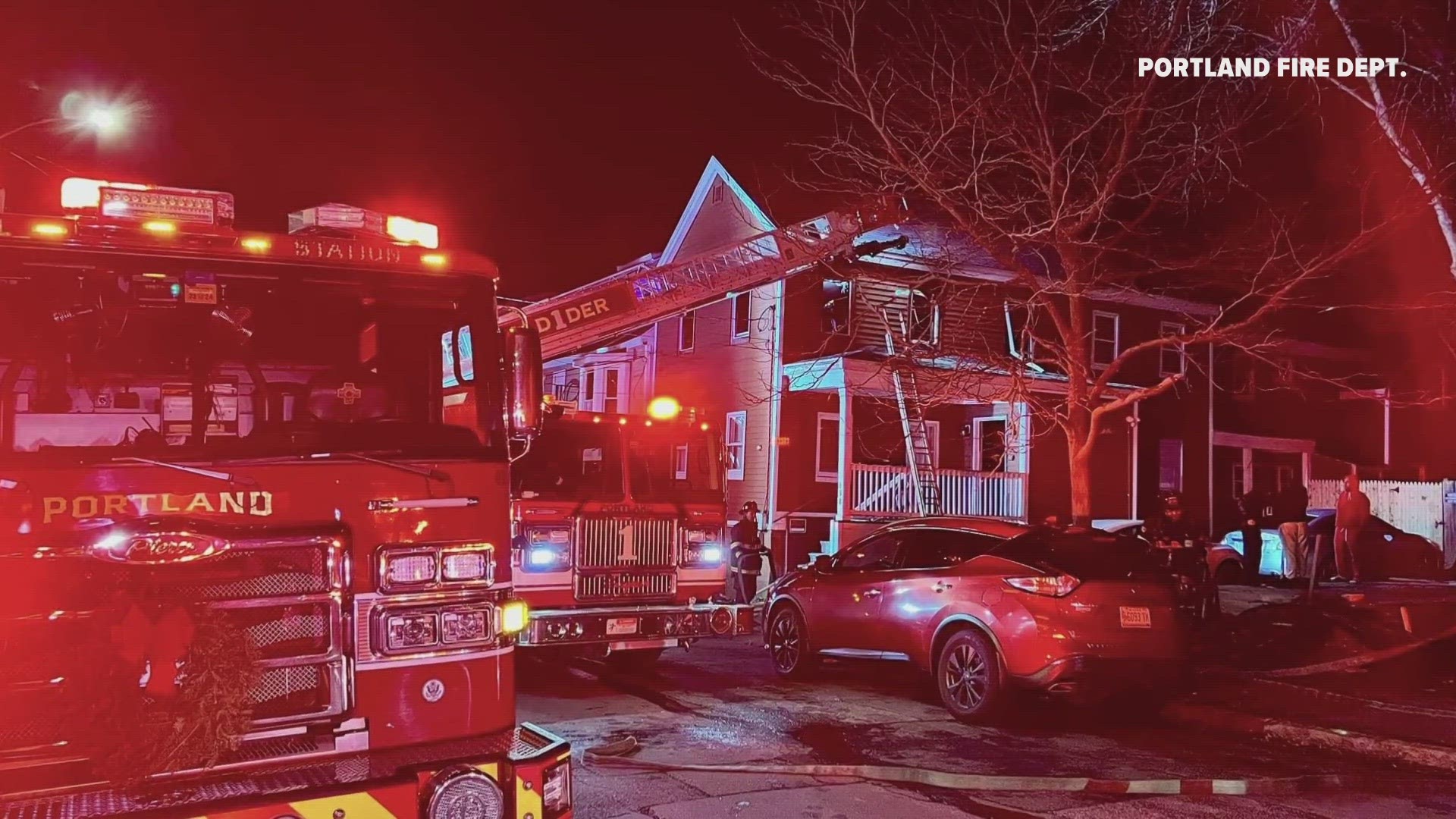 Portland fire officials credited "quick thinking" bystanders with helping one person get off the roof.