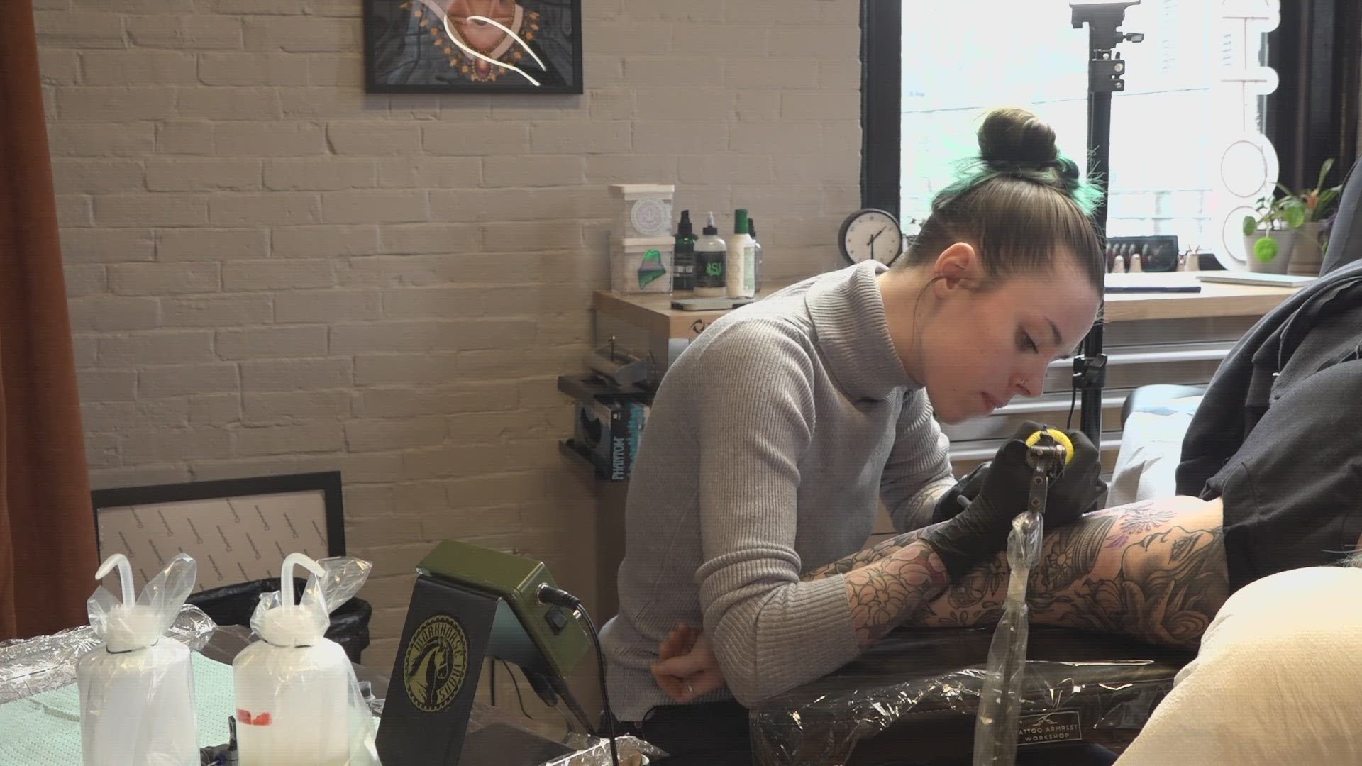 "When I first started, I was told I would not be licensed because I was female and that a tattoo shop is no place for a female," one tattoo artist said.