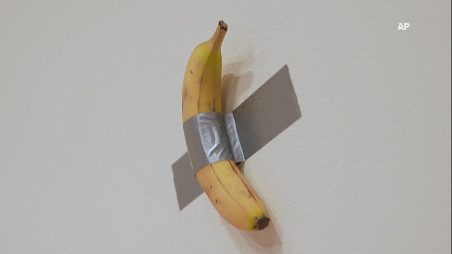 Art piece called "Comedian" goes up for auction. It's a regular supermarket banana taped to a wall with regular duct tape, and it could go for well over $1 million.