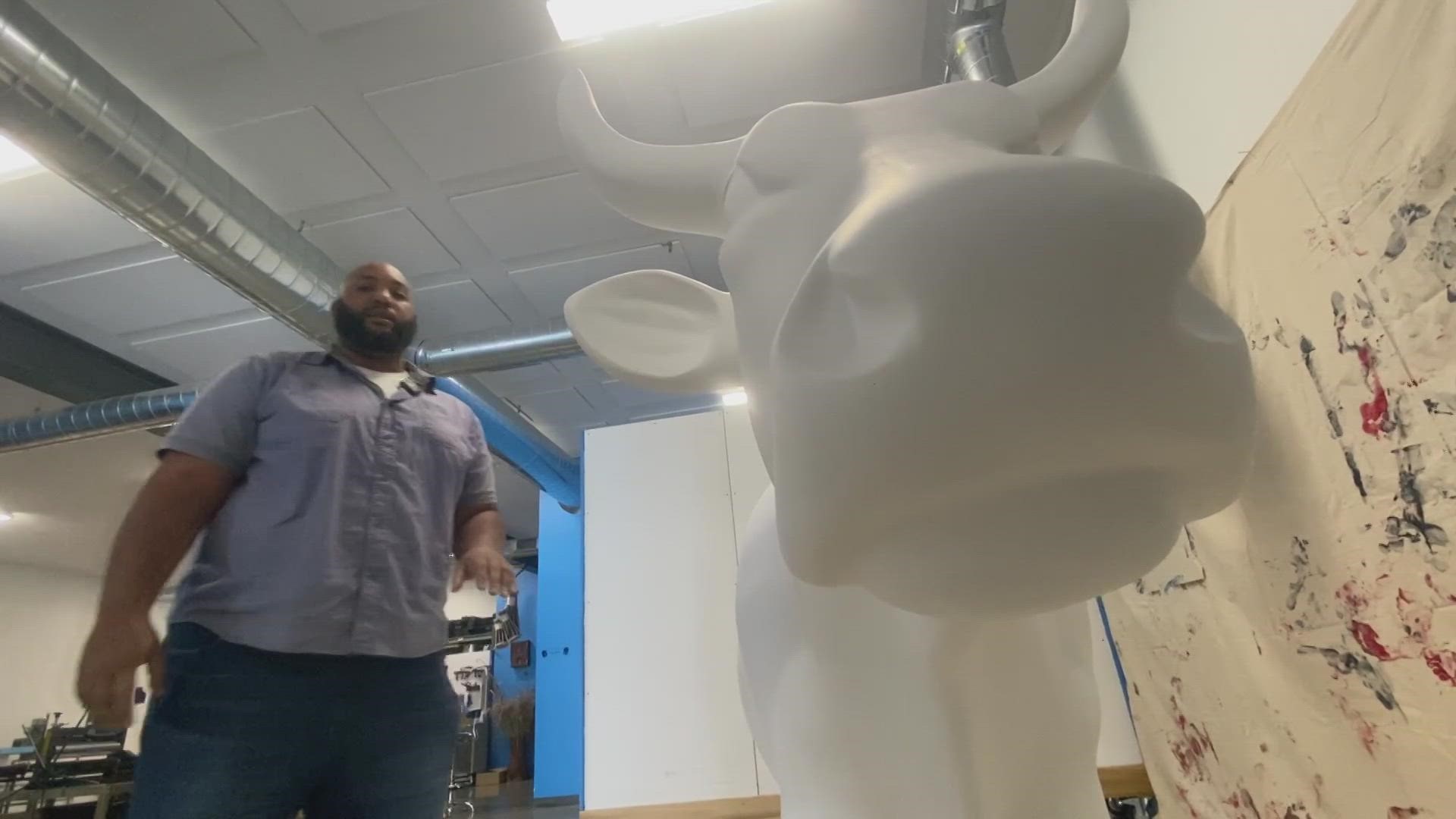 Eamon White is one of 75 artists chosen in New England to paint a cow dedicated to two group efforts to fight cancer. His will be displayed outside Fenway Park.
