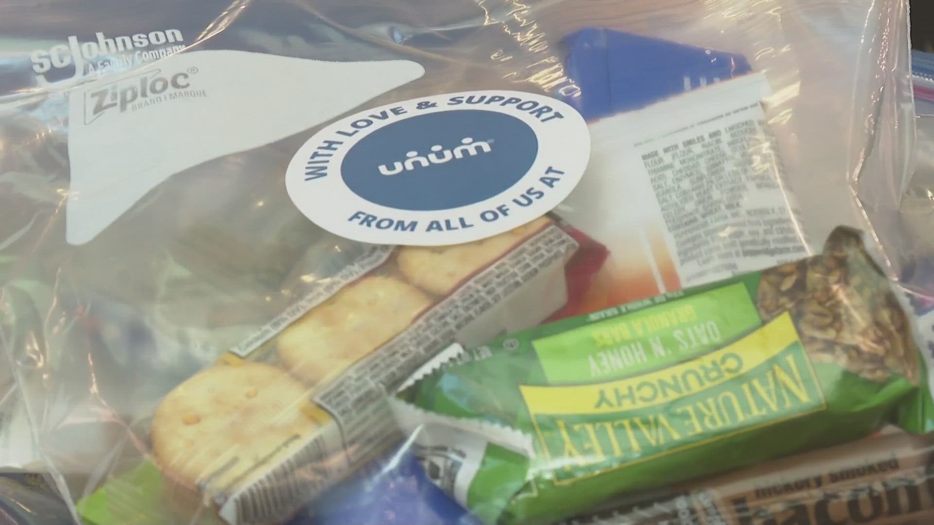 Volunteers with Unum spent the morning packing snack packs for kids at Westbook High School, Presumpscot Elementary in Portland, and the Boys & Girls Club.