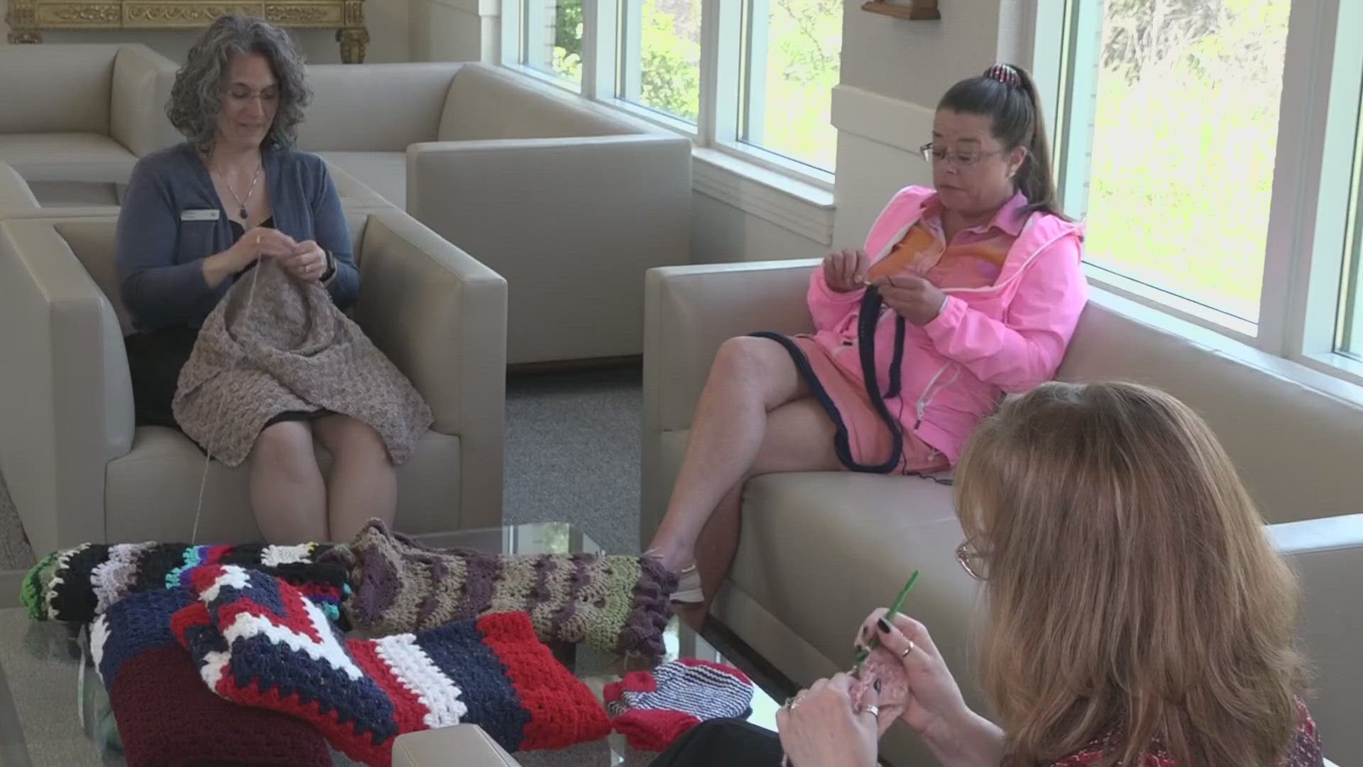 The knitters use their lunch breaks to knit and make the blankets.