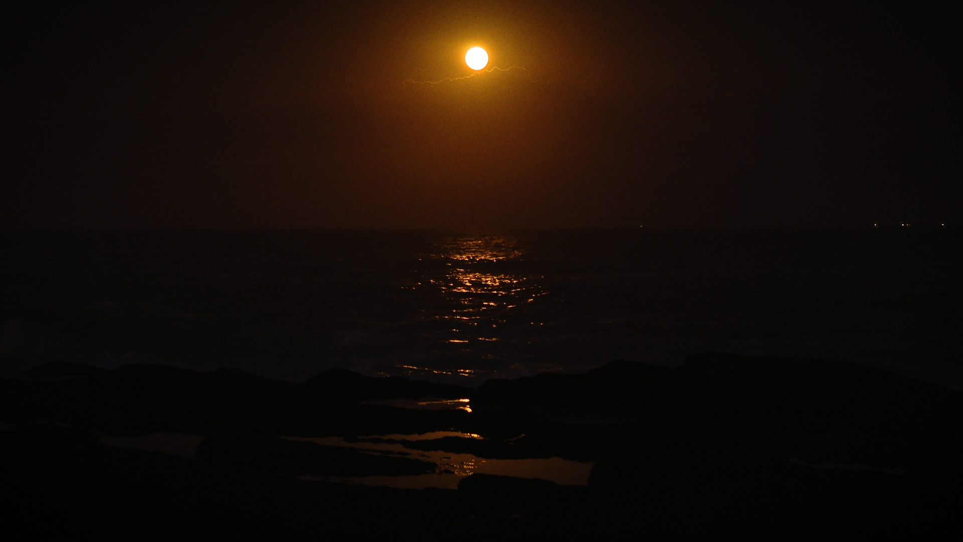 The awe inspiring sight of the Harvest Moon rising over the Atlantic Ocean.