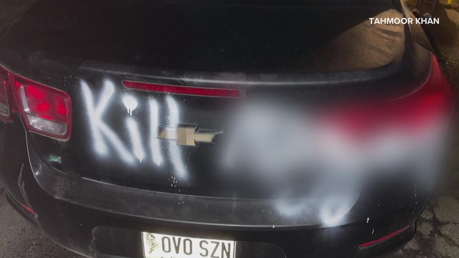 The two 15-year-olds allegedly spray-painted racial slurs and threats on Tahmoor Khan's car in Bangor last month.