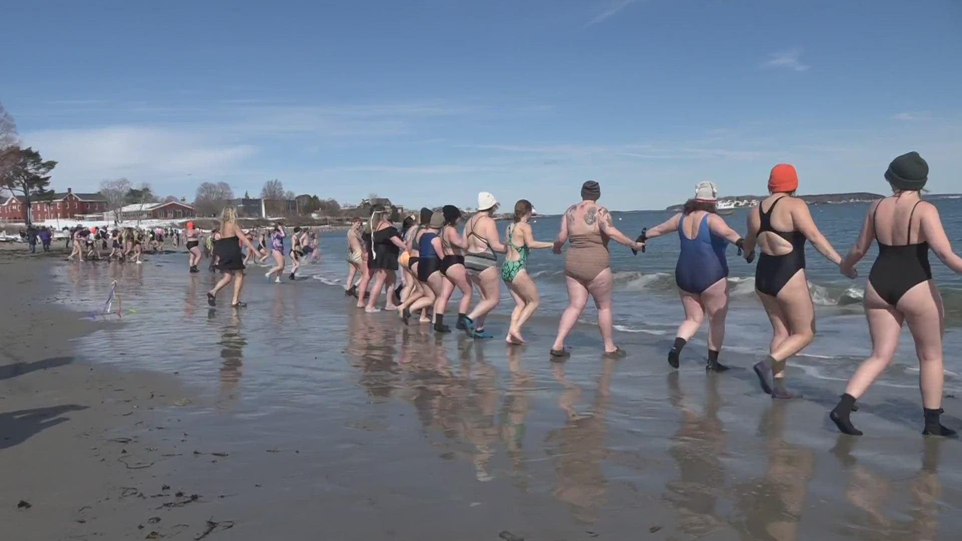 On Sunday, more than 200 women participated in a cold water dip at Willard Beach in South Portland.