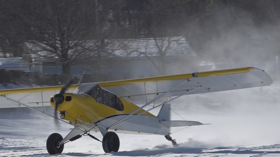 Crowds gather at Dover-Foxcroft's first Ski Plane Fly-In for winter aviation spectacle