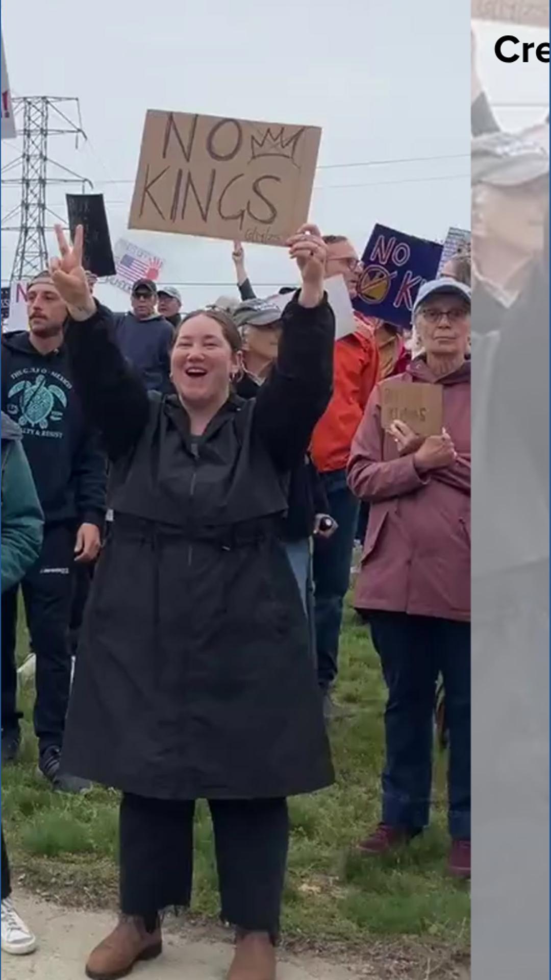 No Kings: Demonstrators hold signs during rally in South Portland ...