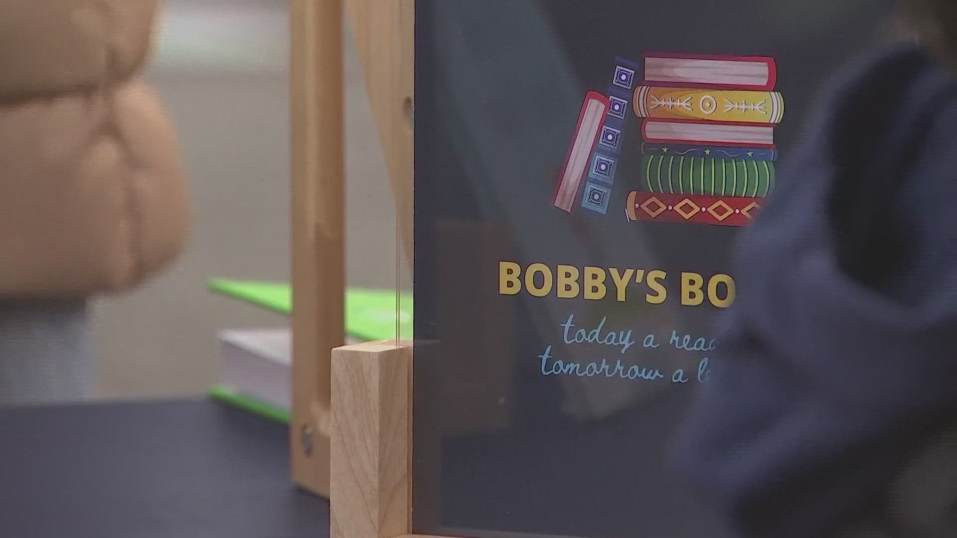 On his first day, Bobby sold 200 books and raised $1,000. 