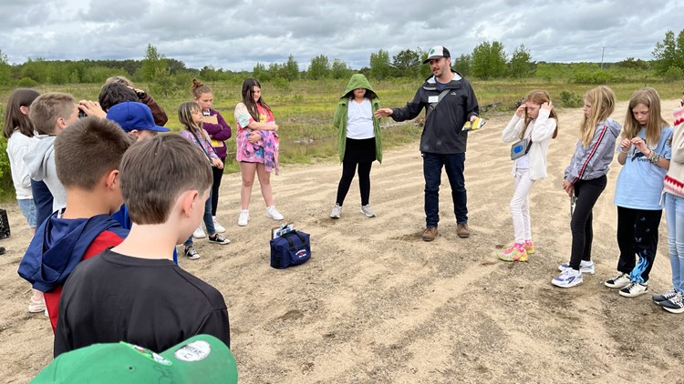 Students who proposed Maine state butterfly visit preserve