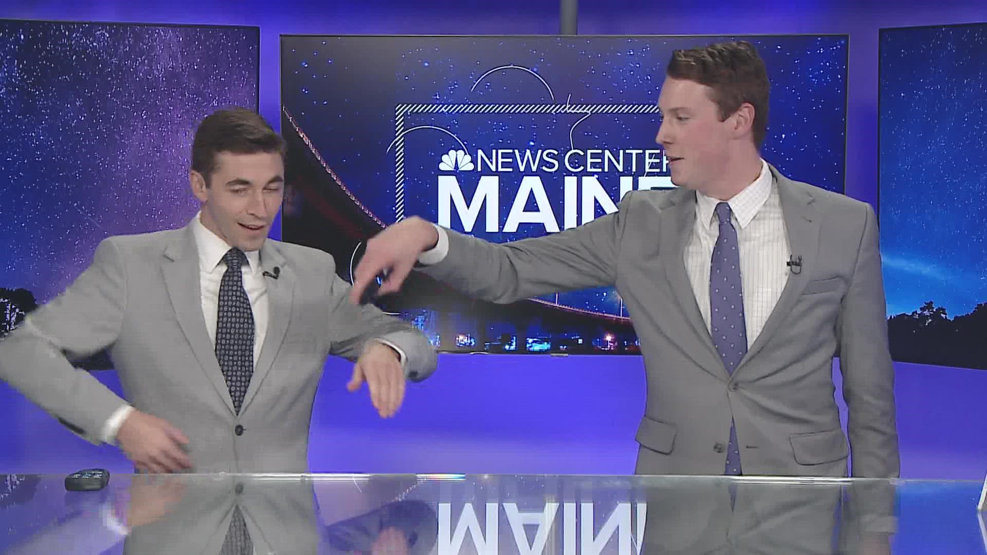 Mike and Sam do the wave in their matching suits