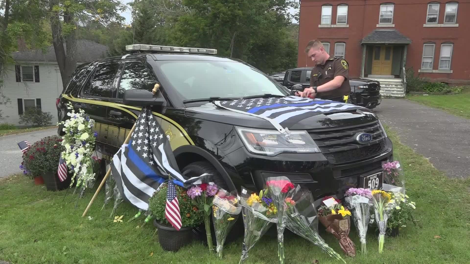 The Hancock County Sheriff's Dept. placed Deputy Gross' cruiser on the side of the road in front of the old jail in Ellsworth on Friday as a memorial.