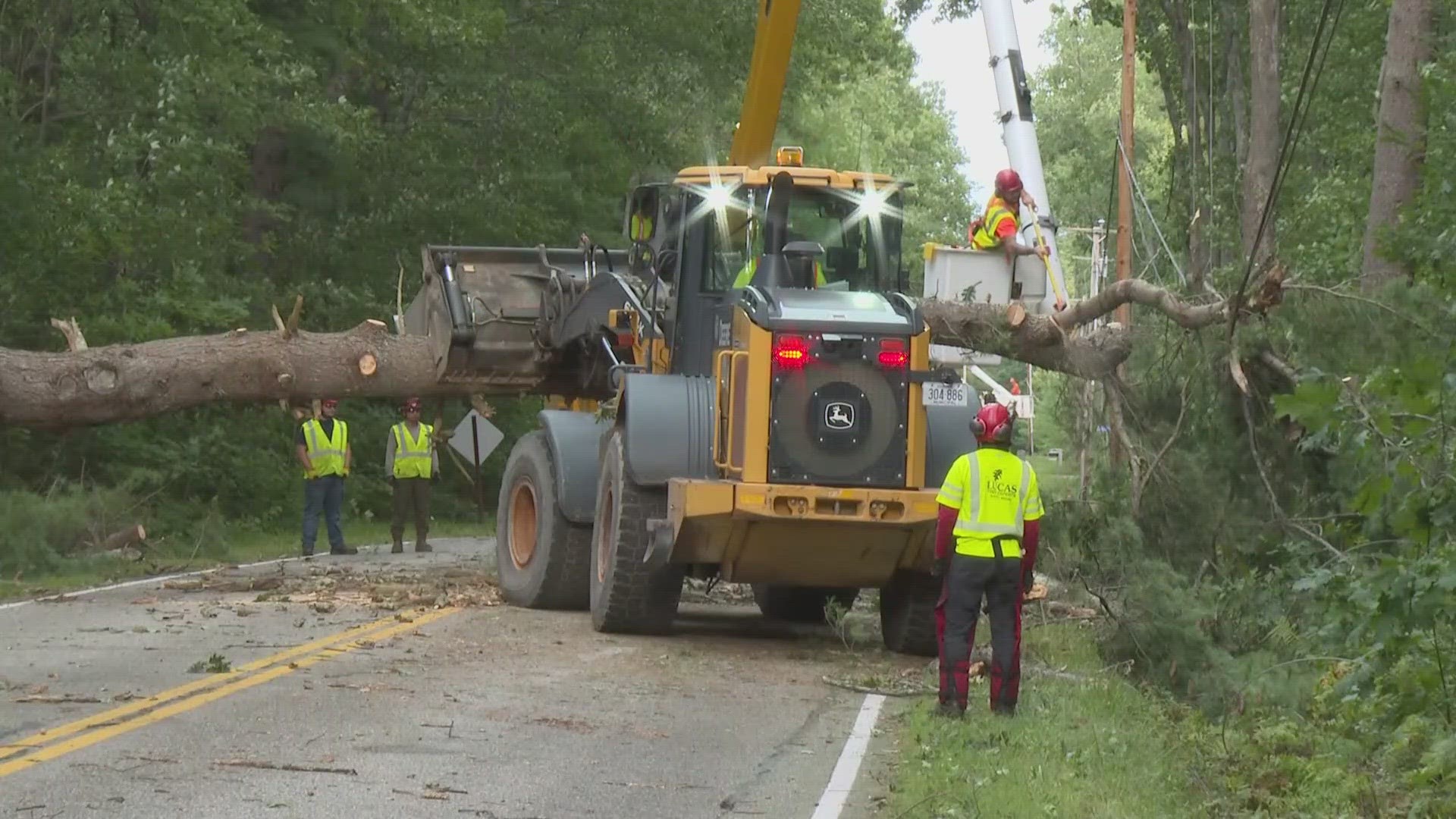 Crews from Ontario helped Central Maine Power restore power and remove debris from downed trees in Scarborough.