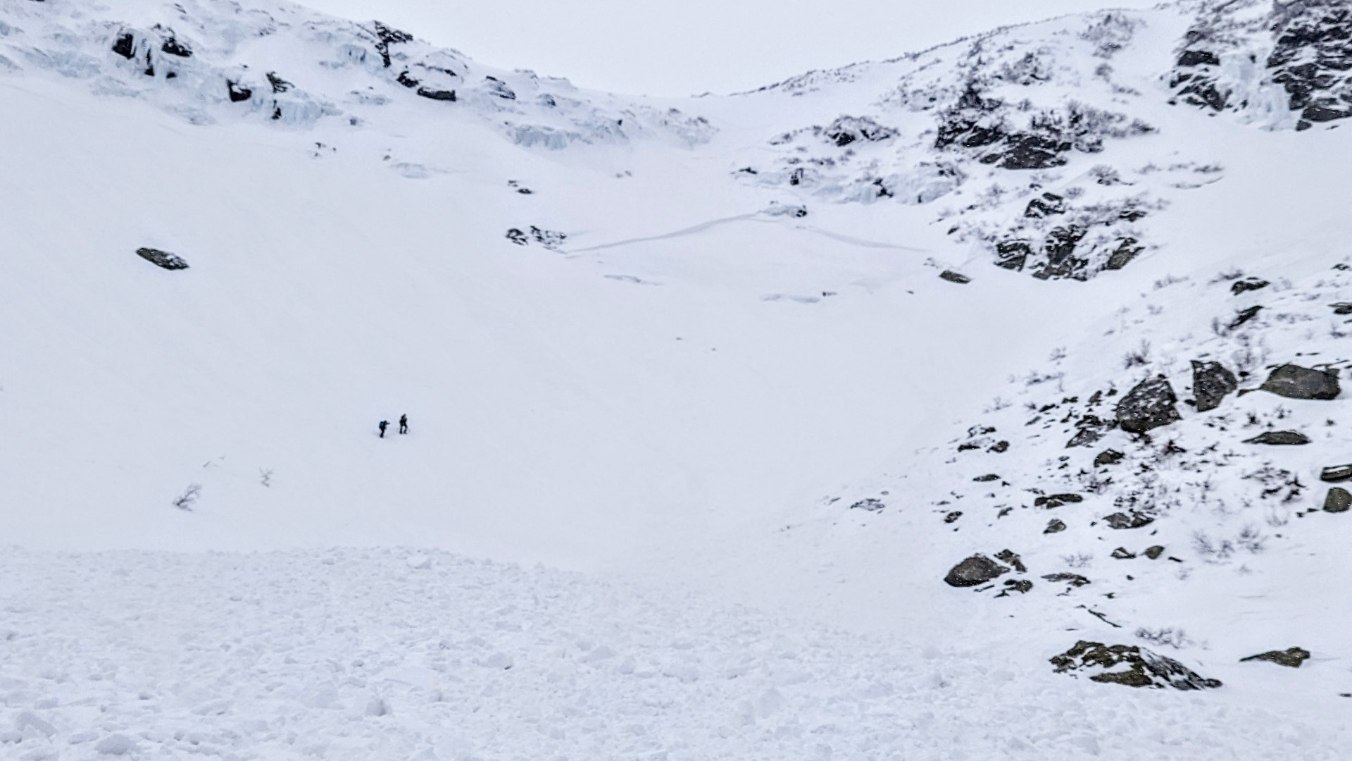The snowboarder was coming down Tuckerman's Ravine, a popular slope for backcountry skiers and snowboarders.