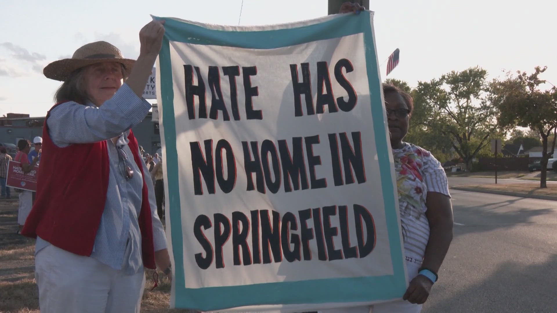 Residents held a march Wednesday night to protest false claims about Haitians eating family pets that were amplified by former President Donald Trump last week.