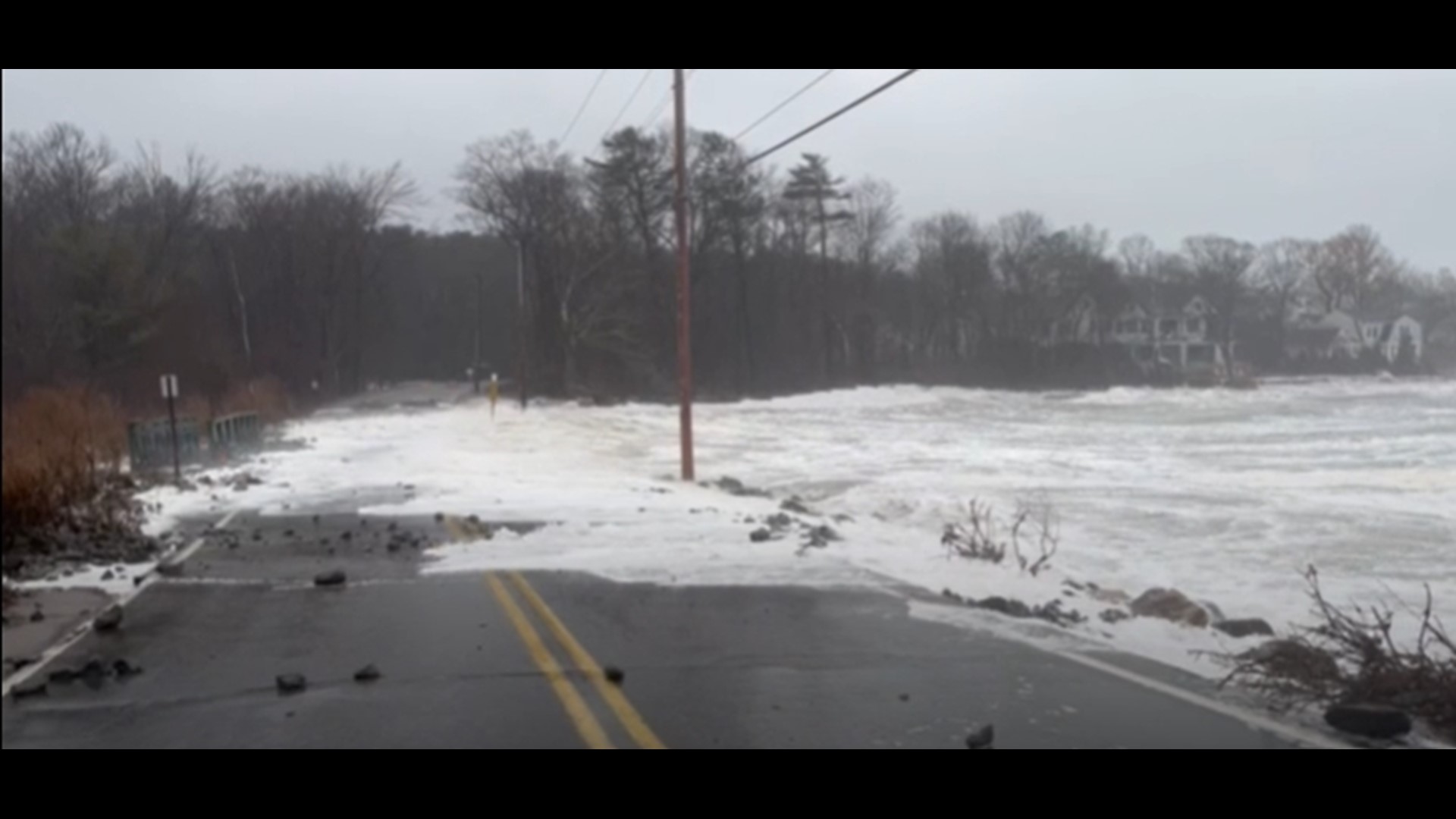 Waves lept over the roadway in Cape Elizabeth during Saturday's storm.