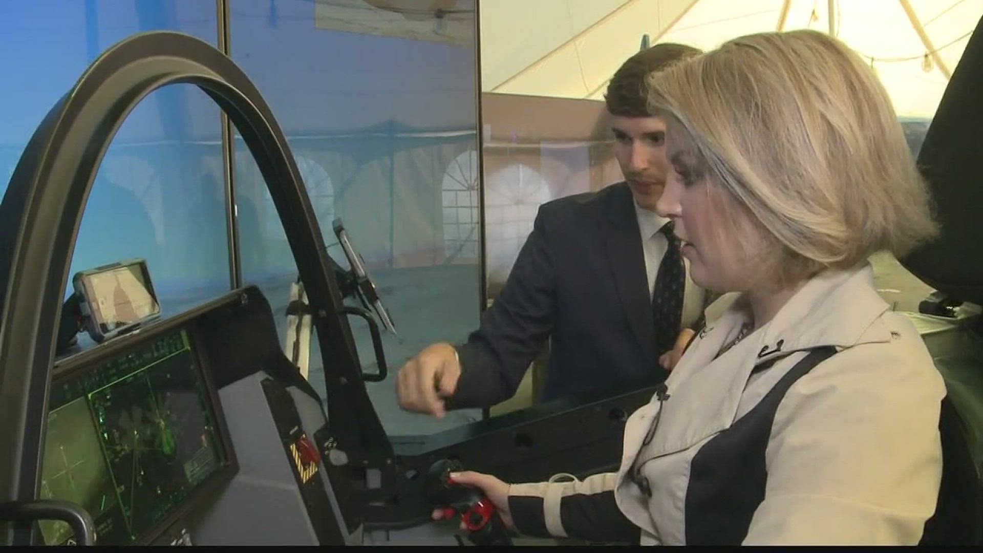 Katie Bavoso flies a fighter jet simulator