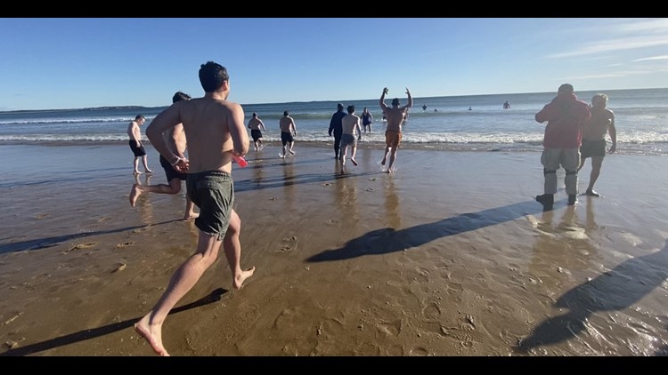 Hundreds jump into the ocean on New Year's Day for 35th annual Lobster Dip