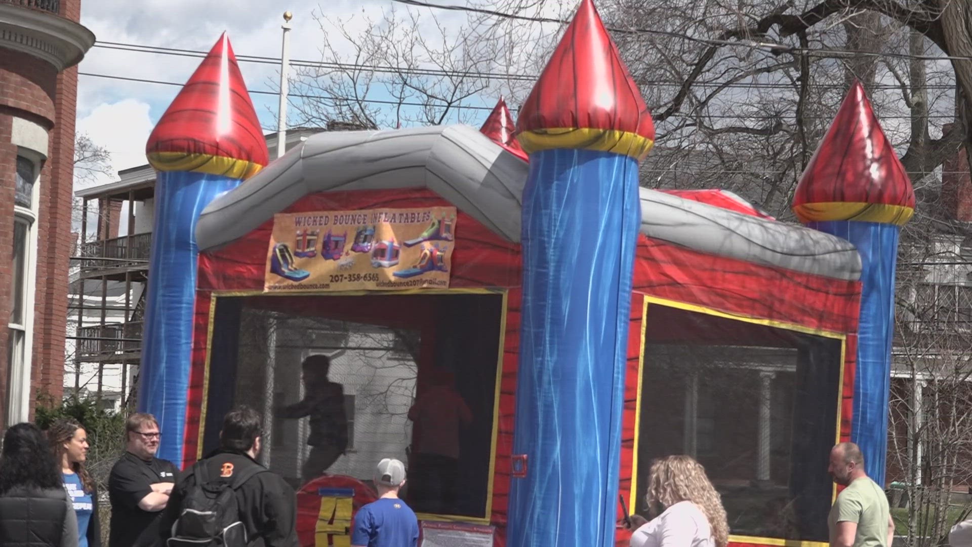 The event aims to connect parents with essential resources going into the summer, all while kids jump around a bouncy castle nearby.
