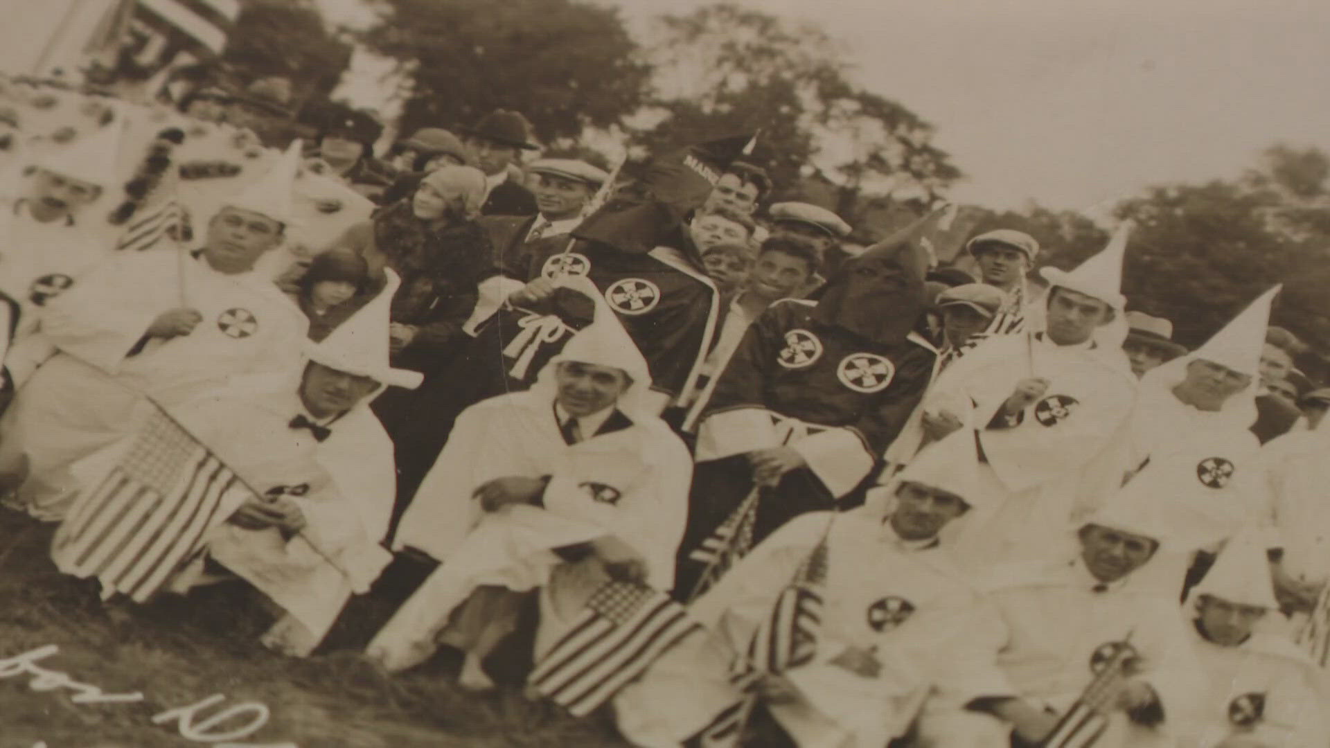 Community members and local leaders gathered at the Biddeford-Saco line Tuesday night to mark a day that's part of Maine's complicated history.