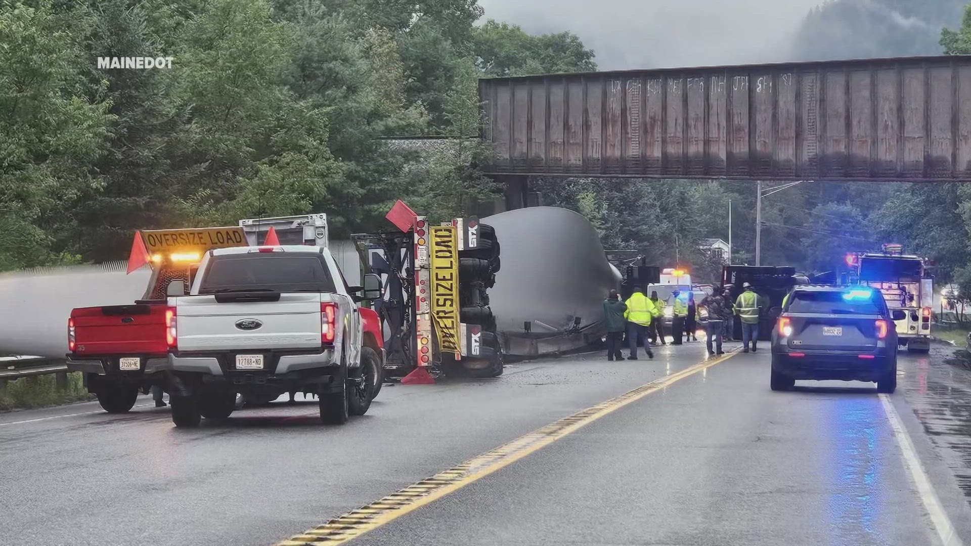 A tractor-trailer hauling a windmill blade to Columbia, Maine, struck a railroad bridge Friday morning while traveling on Route 1 in Stockton Springs.