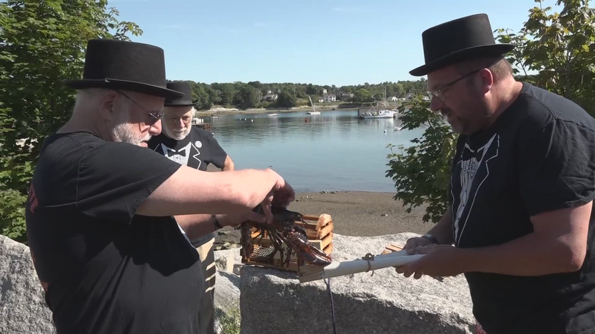 Passy Pete, the predicting lobster, forecasts six more weeks of summer in his annual Labor Day event, delighting spectators.
