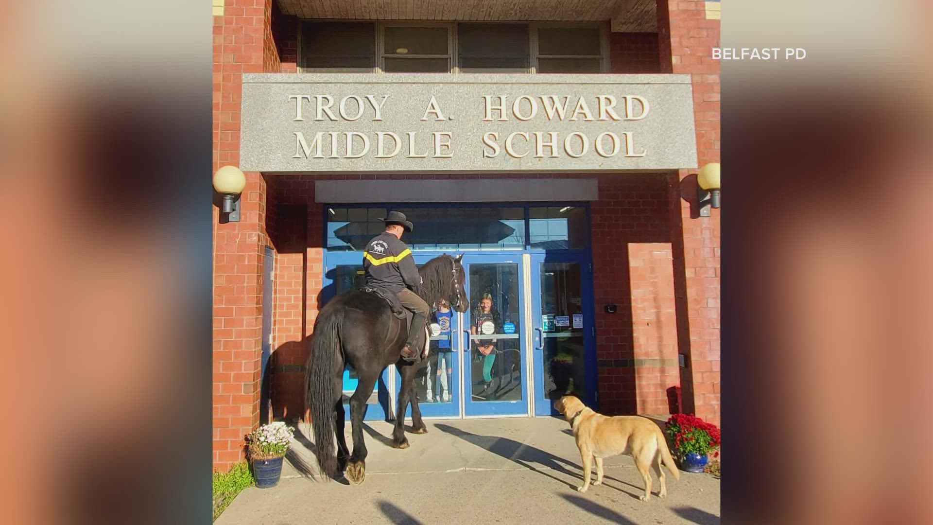 Belfast students were paid a visit by Colonel Gerry Scott of Horses Over America, his horse Hercules, and yellow lab, Molly.