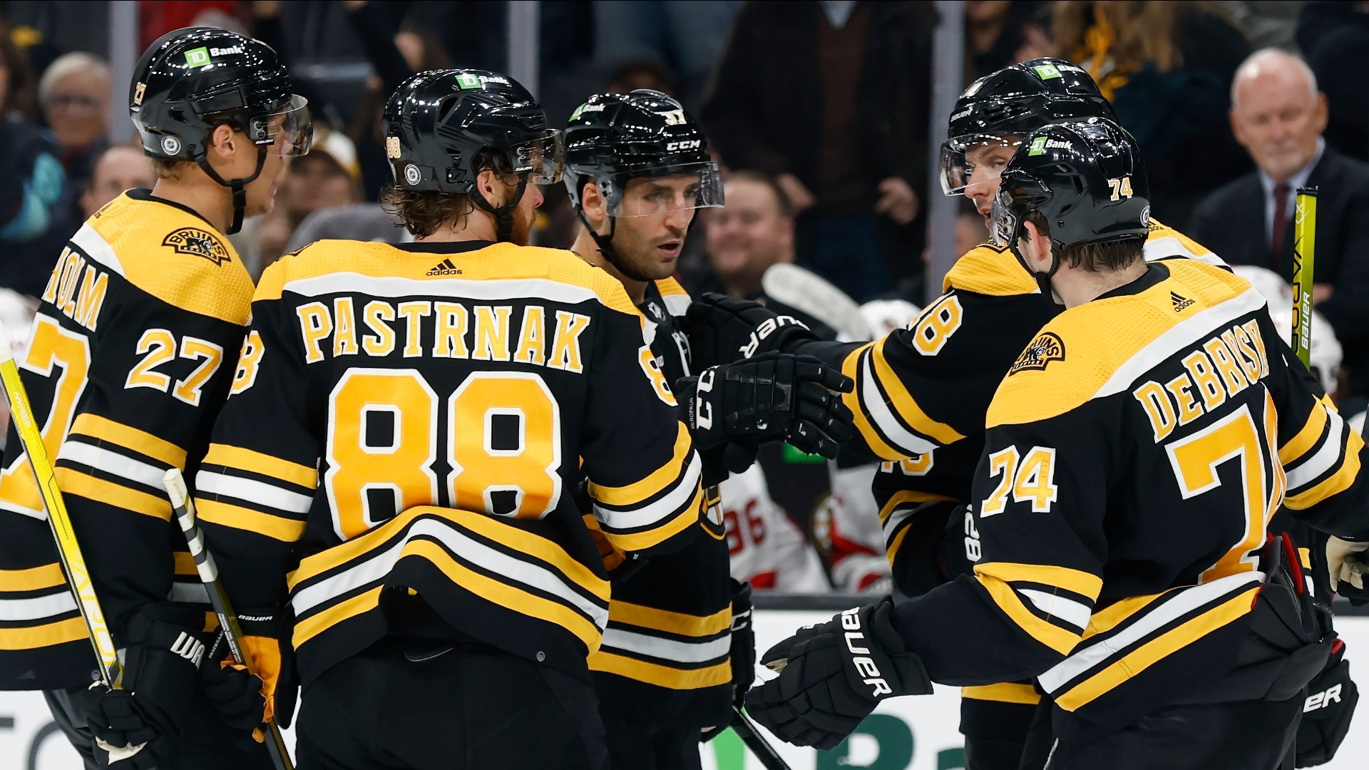 Captain Patrice Bergeron also scored, and Boston beat the Washington Capitals 5-2 on Wednesday night to give Jim Montgomery a victory in his Bruins coaching debut.