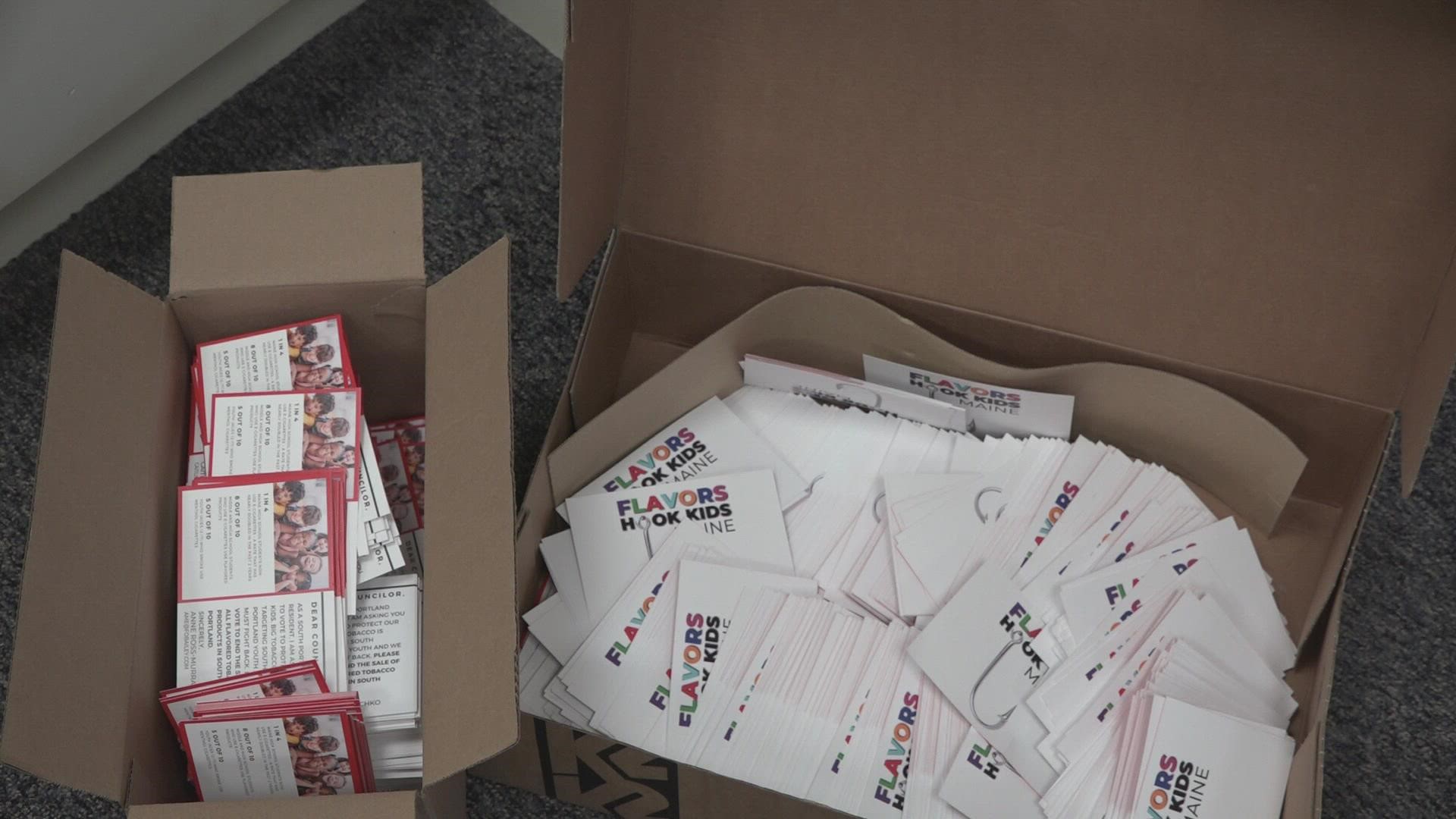 Supporters of the ban dropped off 900 postcards at South Portland City Hall on Tuesday, urging city councilors to vote to end the sale of flavored tobacco products.