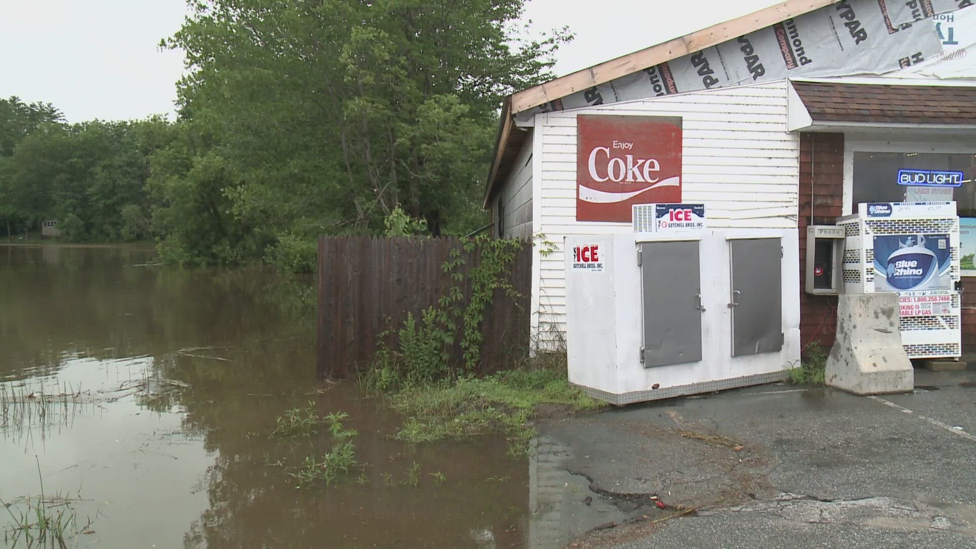 Workers at the Lake Store in front of Lake Pennesseewassee were dealing with floodwaters inches away from the store's electronics. Other area roadways were caved in.