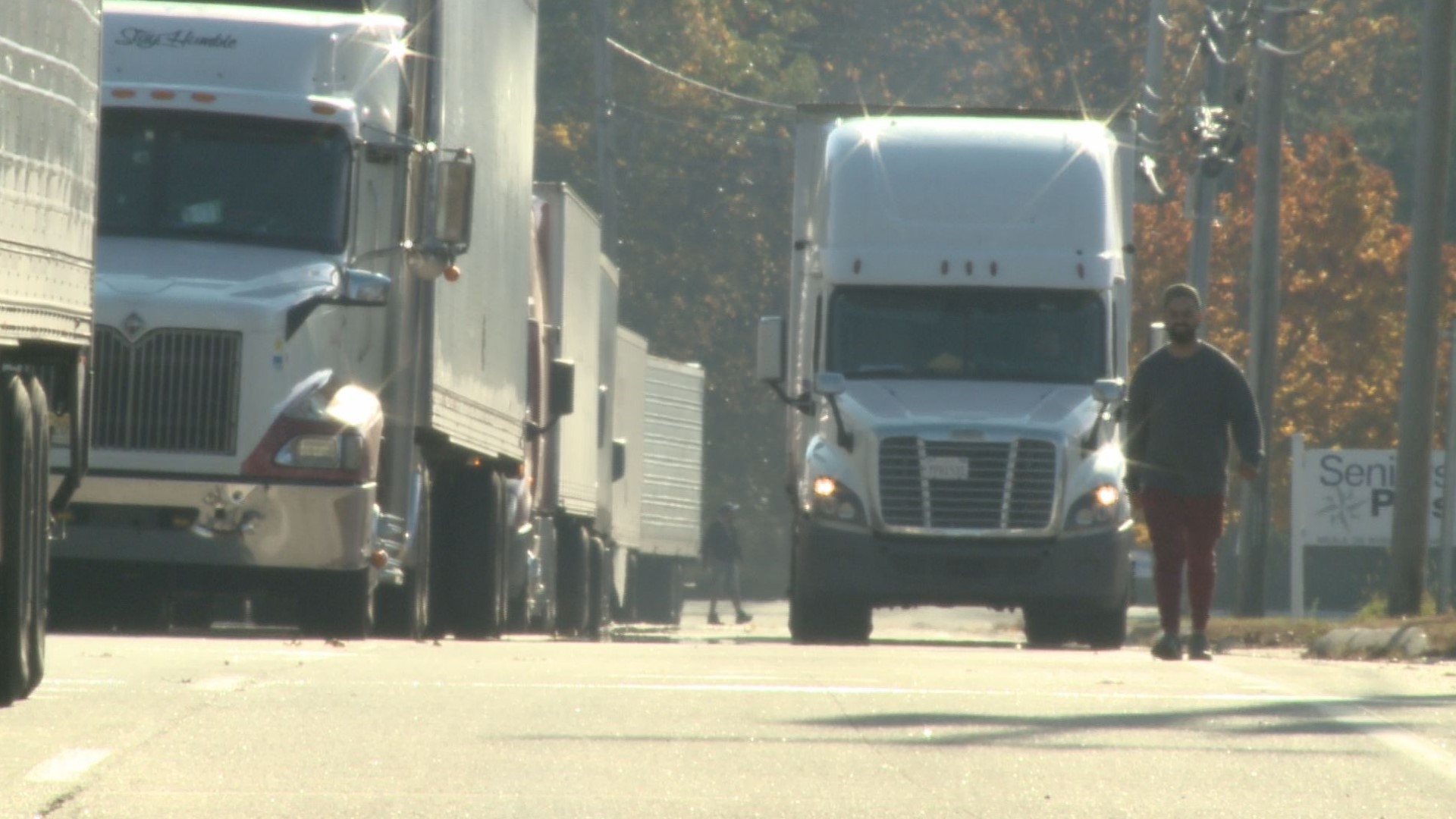 The tractor-trailers are lined up outside waiting to deliver their goods. There's a shelter-in-place order due to the search for the Lewiston mass shooting suspect.