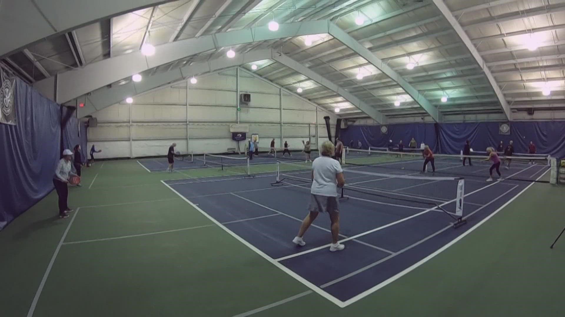 Pickleball is described as a cross between ping pong, badminton, tennis, and table tennis.