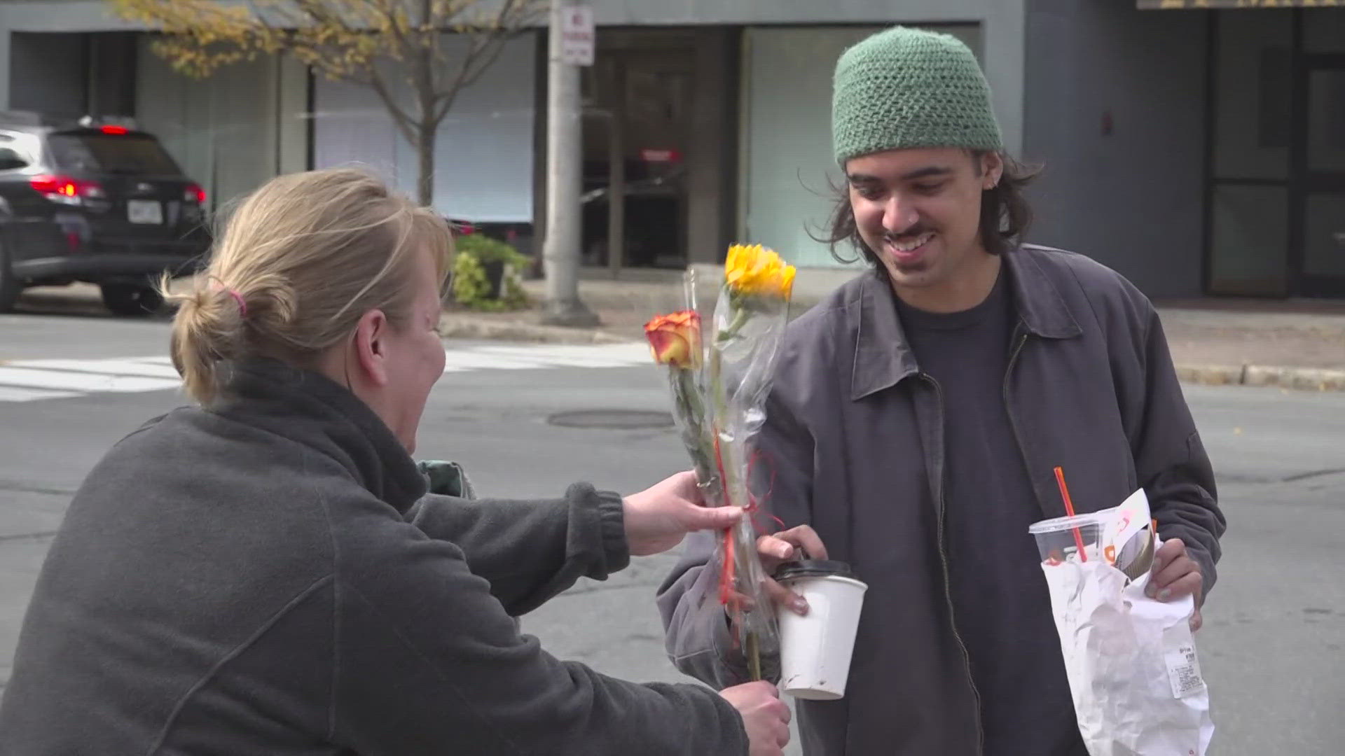 In West Market Square, Bangor Floral employees handed out two flowers to each person who passed by.